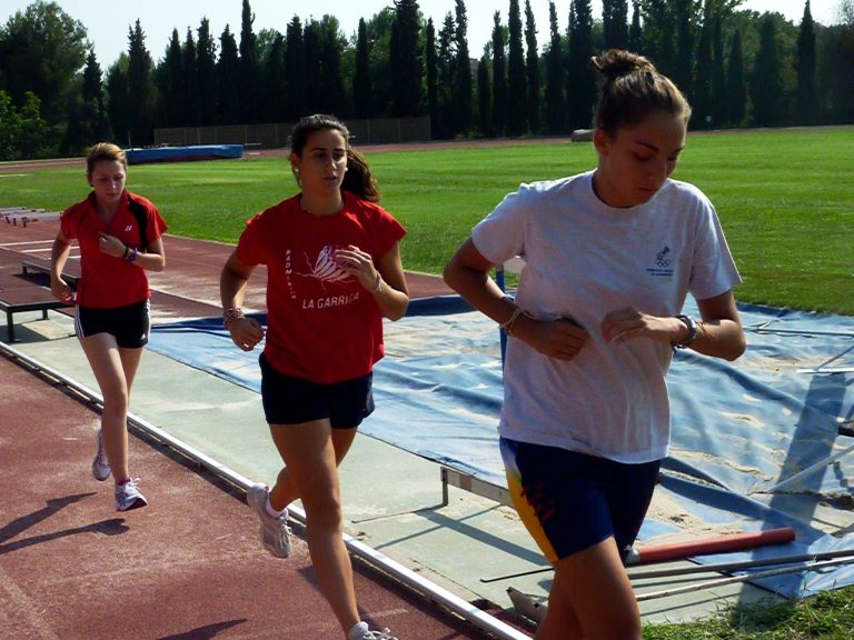 Badminton players running track
